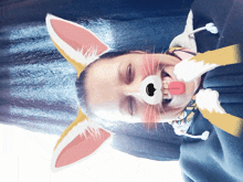 a person with bunny ears on their head making a funny face