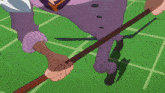 a man in purple pants and a tie is holding a stick