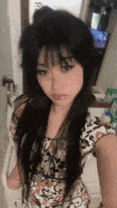 a woman taking a selfie in front of a mirror