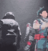 a group of people are standing in a dark room .