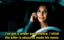 a woman is driving a car and talking on a cell phone with the words " i 've got it under surveillance "