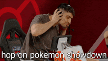 a man wearing headphones sits in front of a monitor with the words hop on pokemon showdown written below him