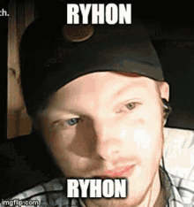 a man wearing a baseball cap with the name ryhon on it