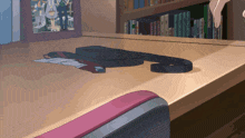 a cartoon drawing of a desk with a tie on it and a picture on the wall behind it