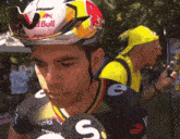 a man wearing a helmet that says red bull
