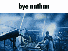 a group of people on stage with the words bye nathan