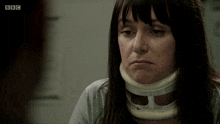 a woman wearing a neck brace says no she didn 't