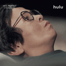 a close up of a person 's face with the words nine perfect strangers behind them