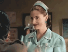 a woman in a nurse 's outfit is smiling and talking to a man