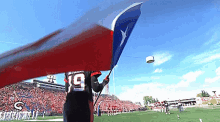 Calgary Stampeders Bo Levi Mitchell GIF - Calgary Stampeders Bo Levi Mitchell Texas Flag GIFs