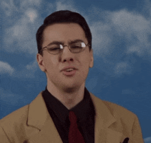 a man in a suit and tie is making a funny face with his mouth open