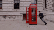 Phone Booth Playful GIF - Phone Booth Playful Running In Circles GIFs