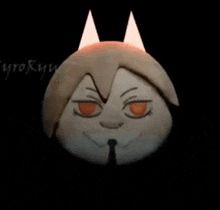 a stuffed animal with horns on it 's head and a tie .