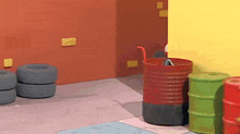 a bunch of barrels and tires in a room