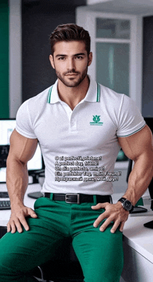 a man in a white shirt and green pants sits on a desk with his hands on his hips