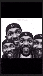 a black and white photo of a man wearing a beanie with the word muzzlug on the bottom