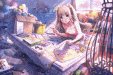 a girl is sitting at a table in a messy room with a laptop and a book .