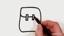 a person is drawing a picture with a marker and the words made in animotica on the bottom