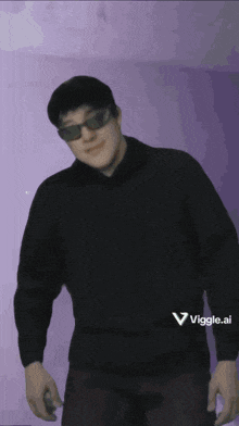 a man wearing sunglasses and a black sweater is standing in front of a purple wall that says viggles.nl