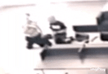 a blurry picture of a person sitting on a couch with a dog .