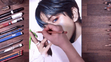 a person is drawing a picture of a person with a pencil that says faber castell on it