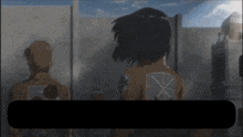 a man and a woman are standing in front of a wall with a large x on the back of their jacket
