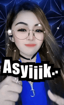a woman wearing glasses and a choker is giving a thumbs up in front of a sign that says asylik