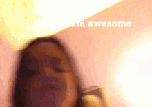 a blurry picture of a girl with the words " i am awesome " written on the bottom