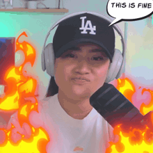 a woman wearing a la hat and headphones says " this is fine "