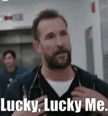 a man with a beard is holding a stethoscope around his neck and saying lucky lucky me .