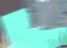 a blurry picture of a person 's face with a blue background .