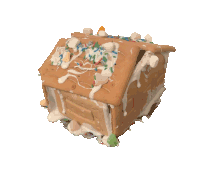 a gingerbread house made out of a graham cracker with icing and sprinkles