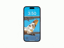 a phone screen shows a message from etihad airways that says it 's time to fly from abu dhabi to the world