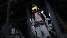 a robot with glowing eyes and a belt that says ' ghost ' on it