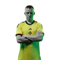 a man with his arms crossed wears a yellow adidas jersey