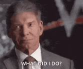 a man in a suit and tie is asking a question .