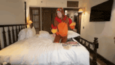 a person in a monkey costume is standing on a bed