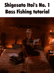 a man is sitting on a bed reading a book titled shigesato itoi 's no 1 bass fishing tutorial