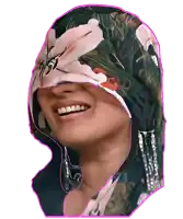 a woman wearing a floral scarf covering her eyes