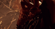 a close up of a person 's face with fire coming out of their mouth