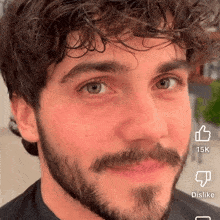 a man with a beard has a thumbs up and a dislike button