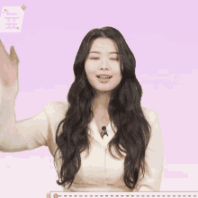 a woman with long hair has a speech bubble with a heart and the number 1 above her head