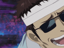 a man with sunglasses and a bandage on his head is smiling