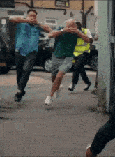 a man wearing a blue shirt that says emirates on it