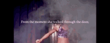a woman walking through a door with the words from the moment she walked through the door below her