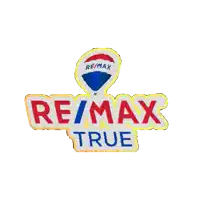 a re/max true logo with a blue circle in the center