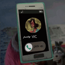 a phone with a picture of a woman and the name vic on it