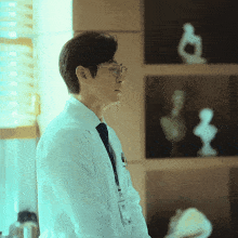 a man in a lab coat has a name tag that says ' dr. '