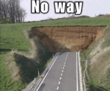 a road with a large hole in the middle of it .