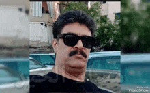 a man with a mustache wearing sunglasses and a black shirt made with videoshow